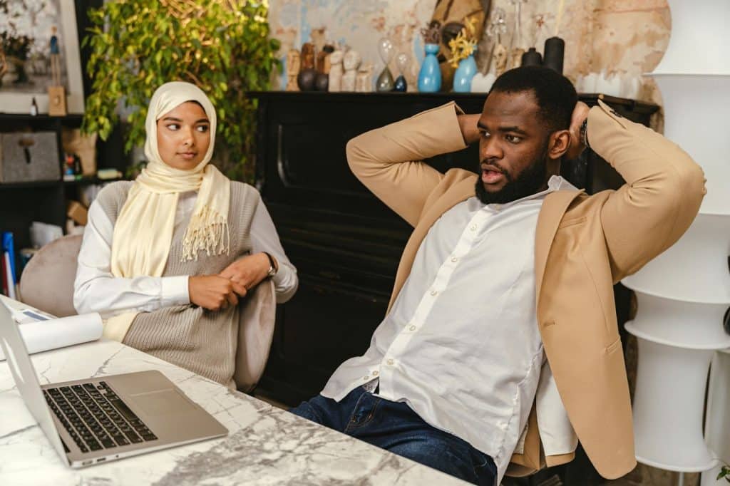 A man resting his back and a woman looking at him