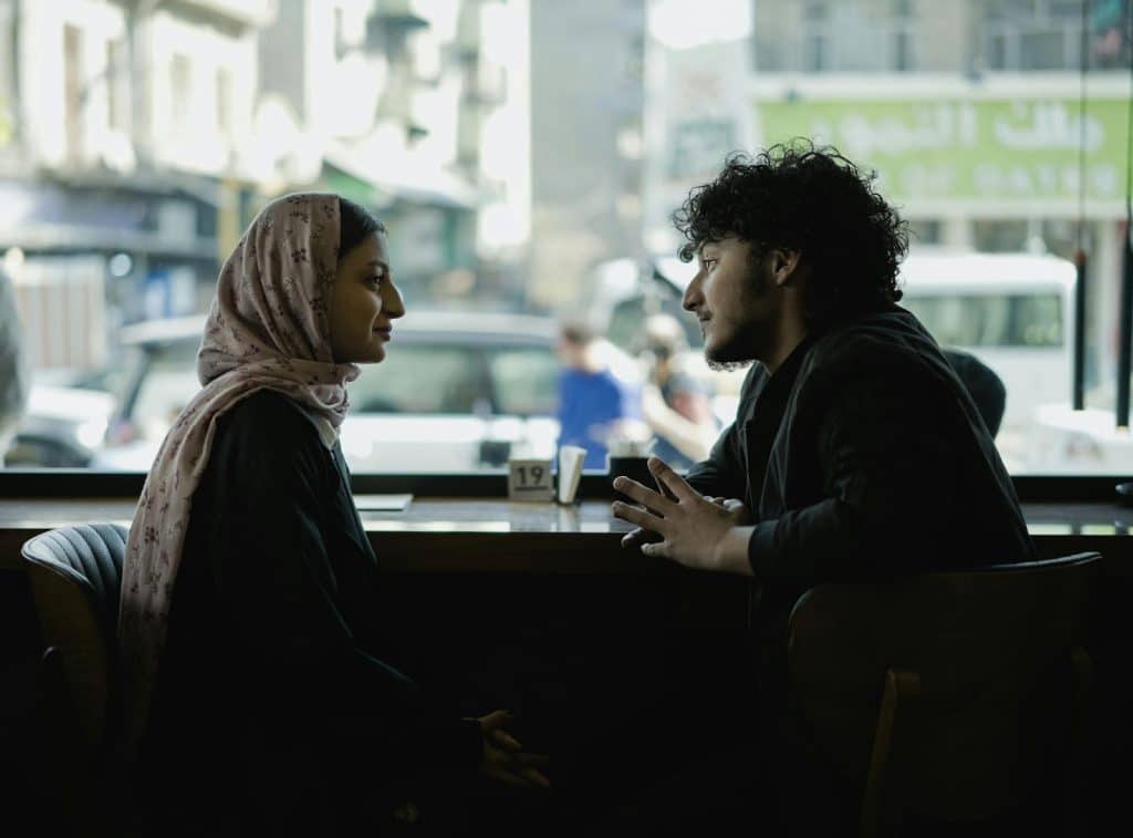 A man and woman talking