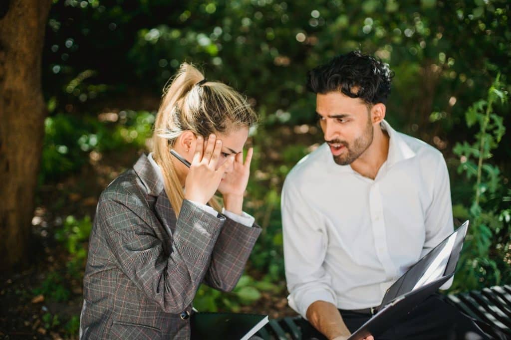 A man talking to a woman