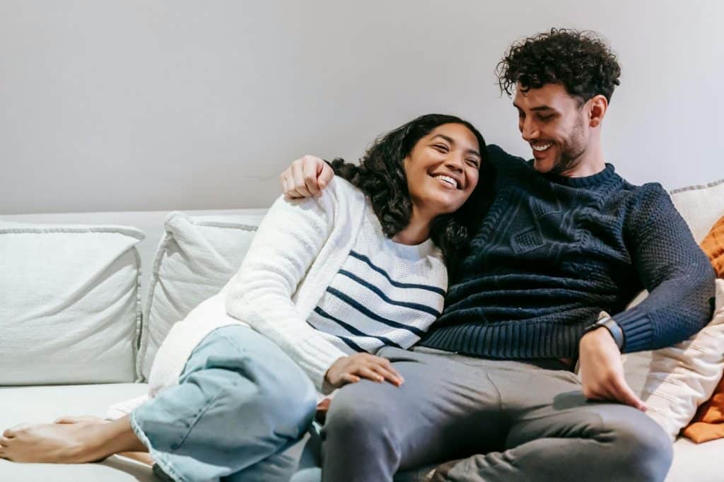 A man and woman at the couch