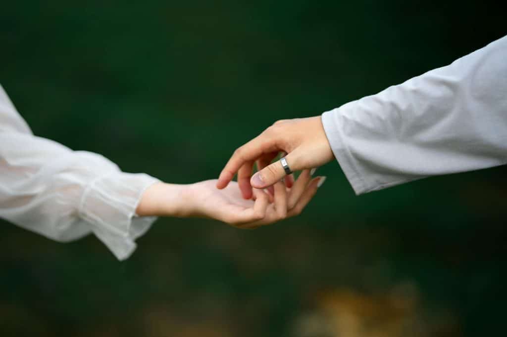 A man and woman holding hands