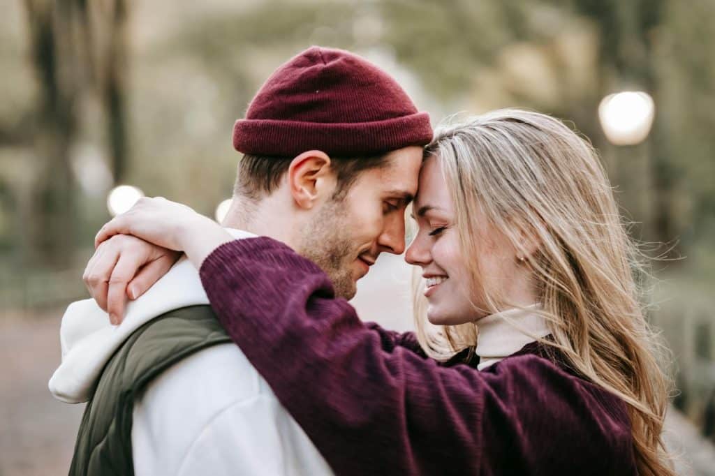 A man and woman facing each other
