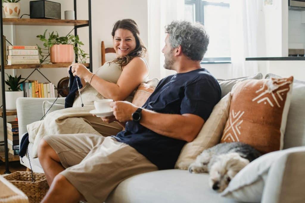 A man smiling at his wife