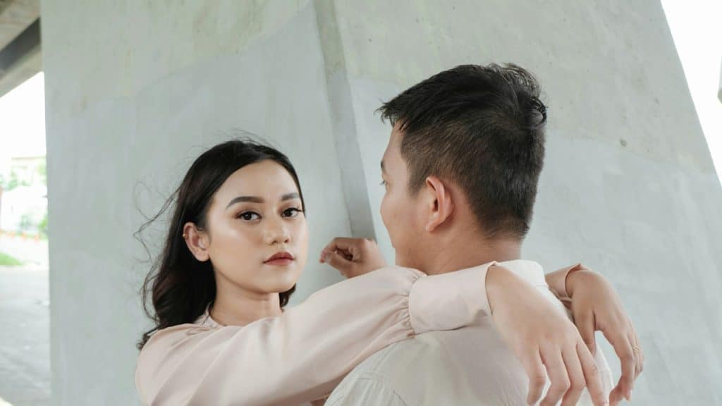 A man and a woman standing next to each other.