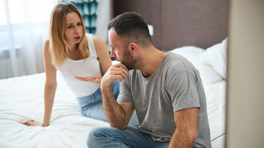An angry woman complaining to her husband.