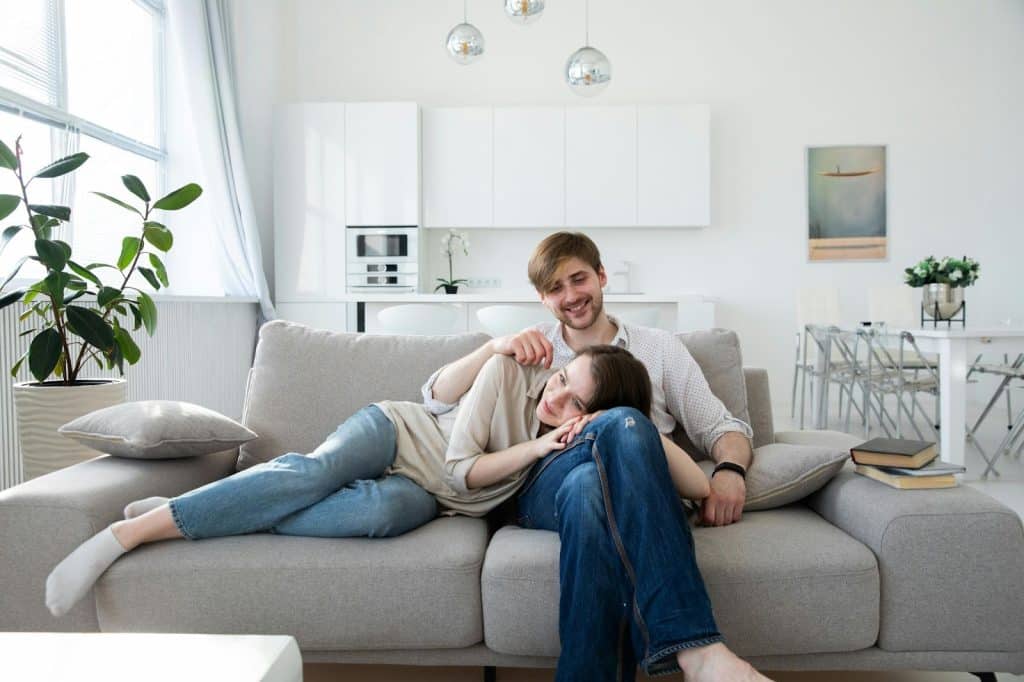 A man and woman at the couch