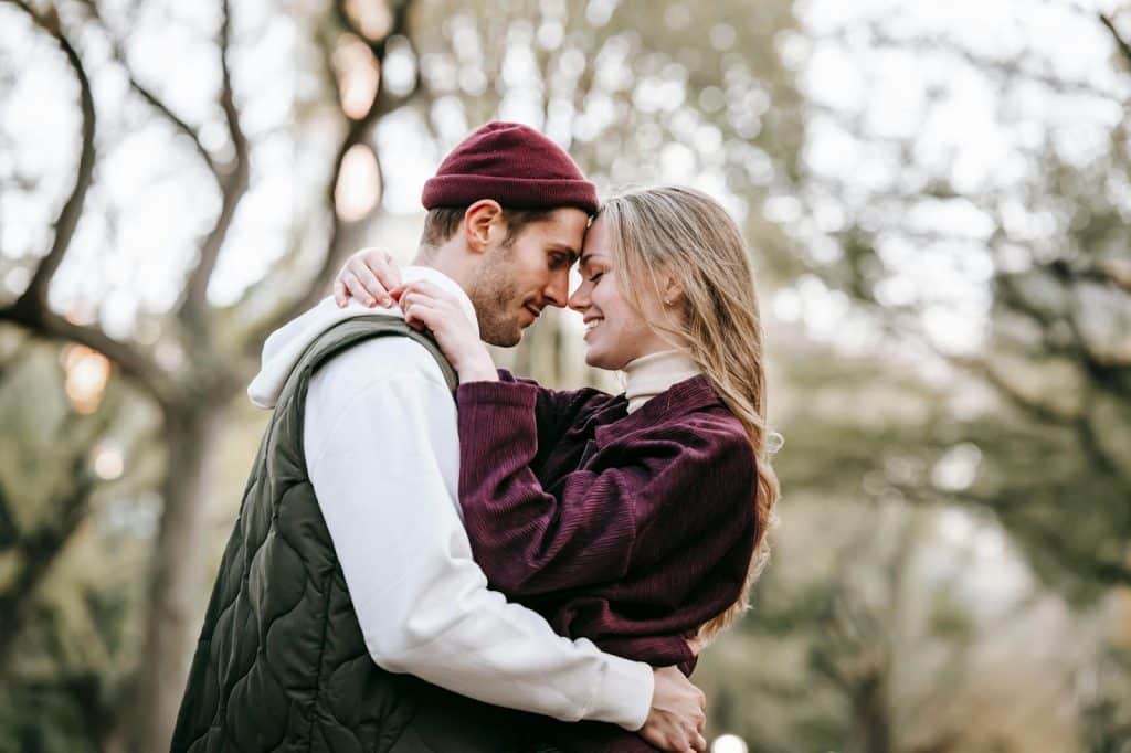 A man and woman facing each other