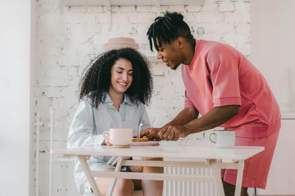 A man prepared a breakfast for a woman