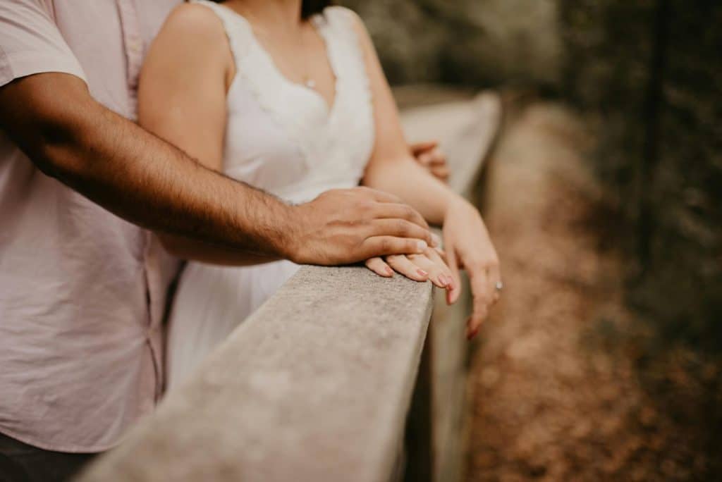 A man hugging a woman from behind