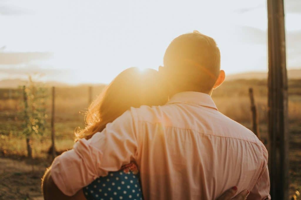 A man and woman watching the sunset