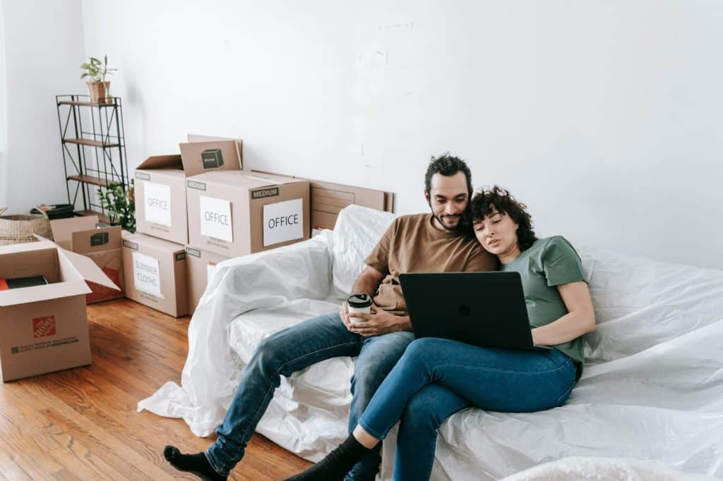 A man and woman resting in the couch
