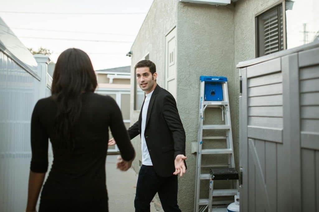 A man and woman talking while walking