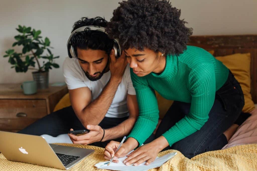 A man and woman checking something