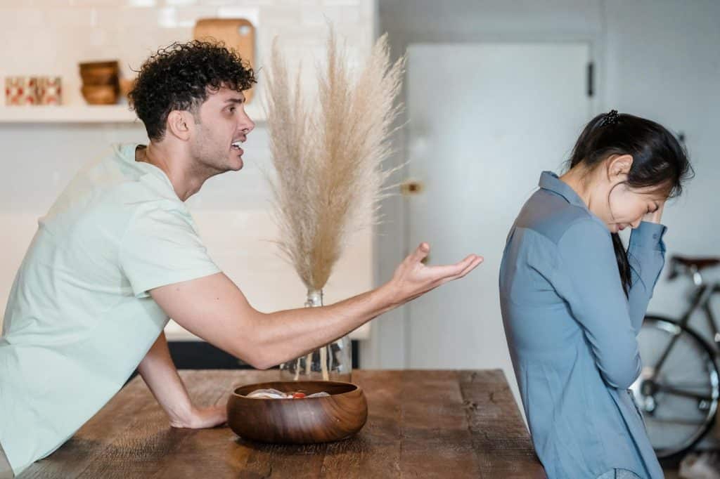 A woman turning her back to a man