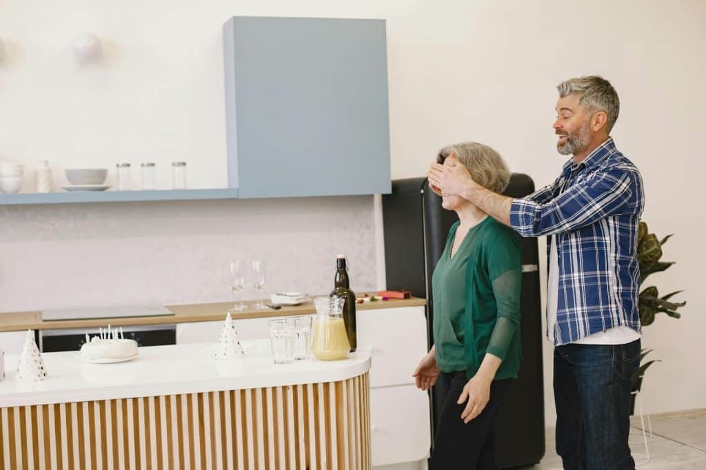 A man surprising his partner with a new house