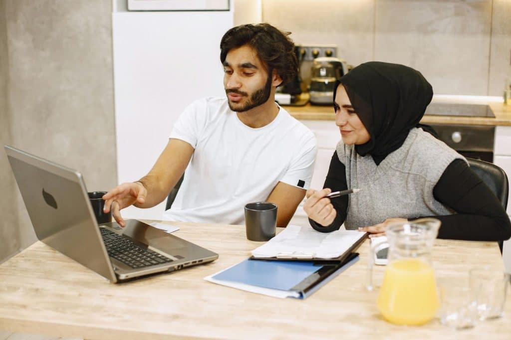 A man teaching a woman something