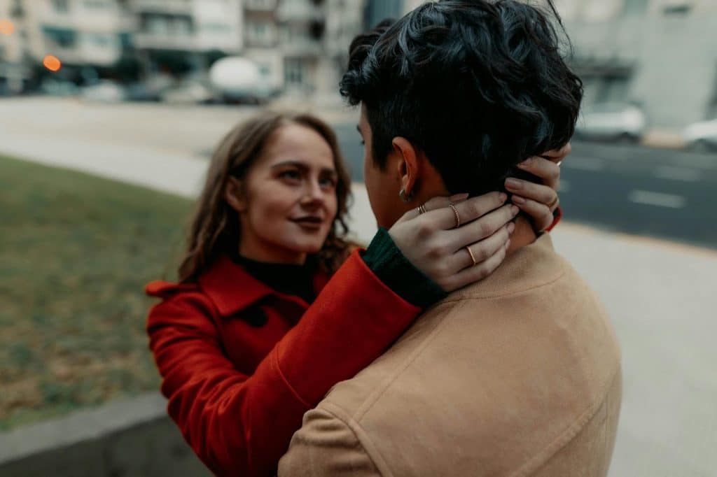 A woman hugging a man