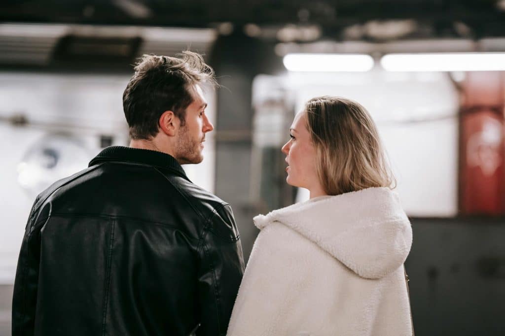 A man and woman looking at each other