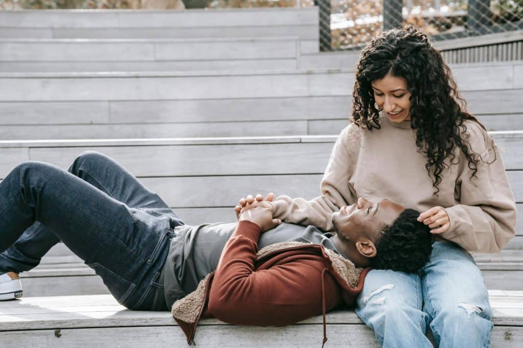 A man resting his head to a woman’s lap
