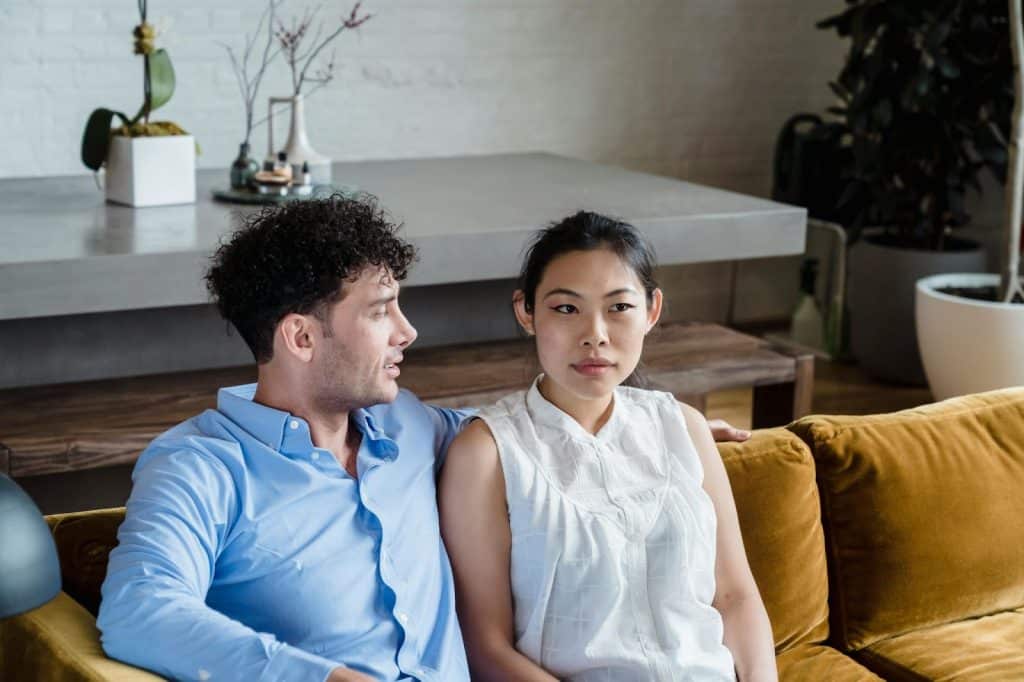 A man and woman sitting.