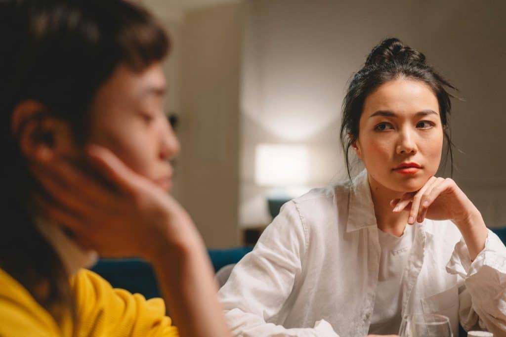 A woman upset and she’s looking at the man
