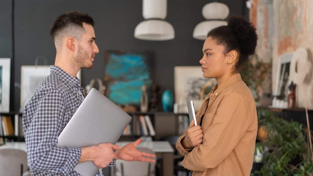 A man and woman facing each other