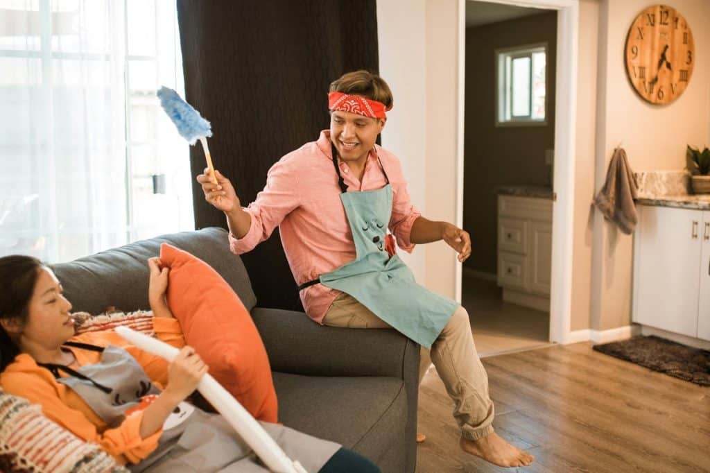 A man and woman cleaning