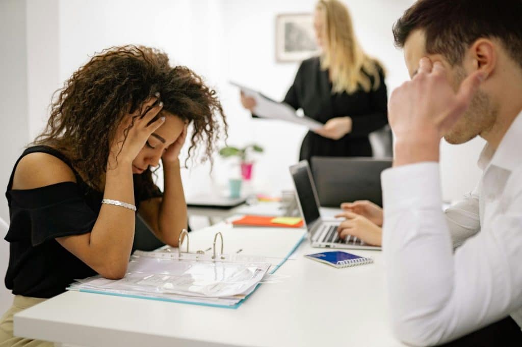 A man and woman looking tired