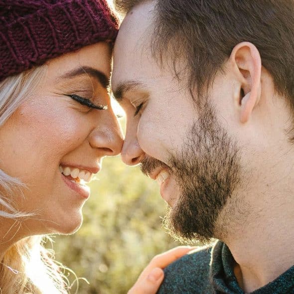 A man and woman facing each other