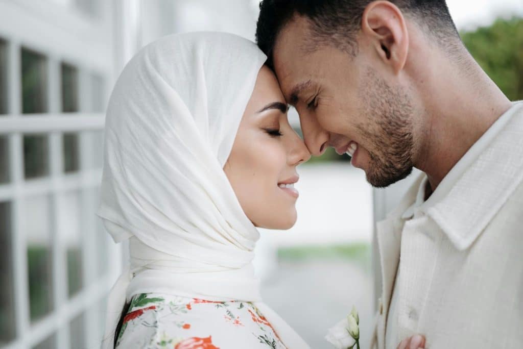 A man and woman facing each other