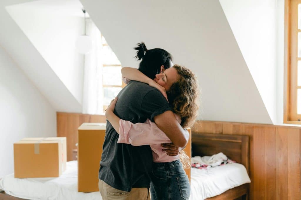 A man and woman hugging each other