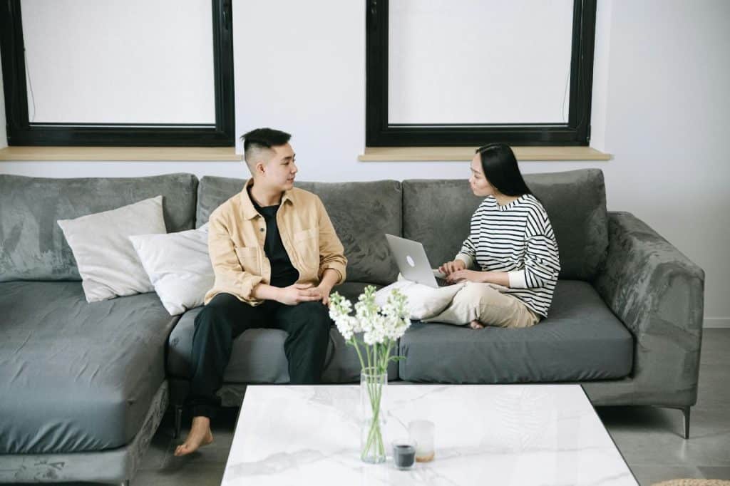 A man and woman at the couch