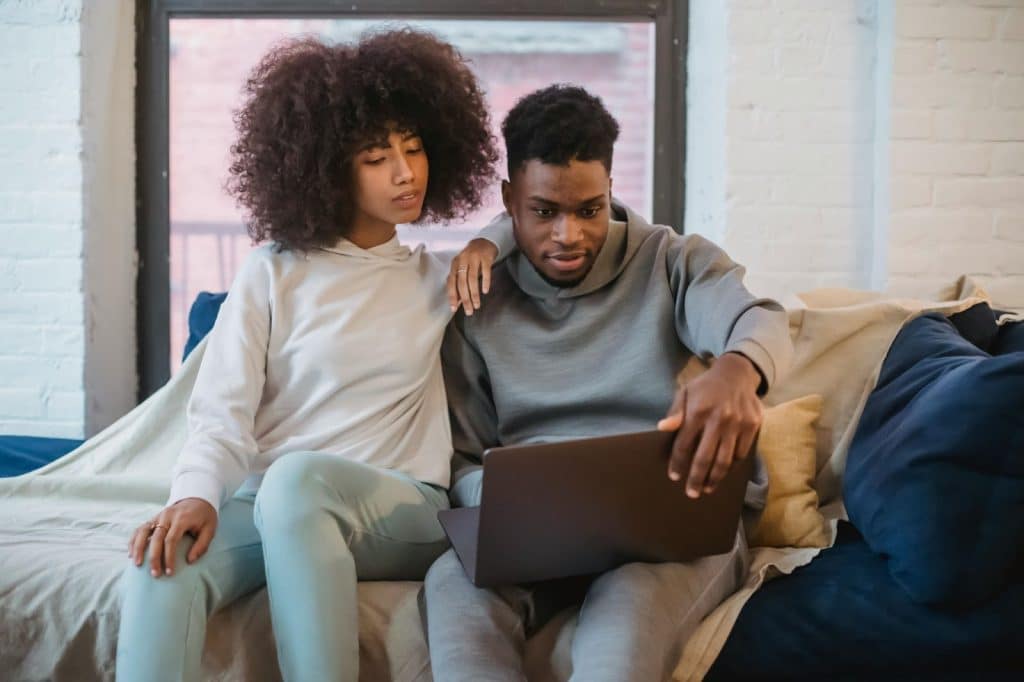 A couple looking at the laptop