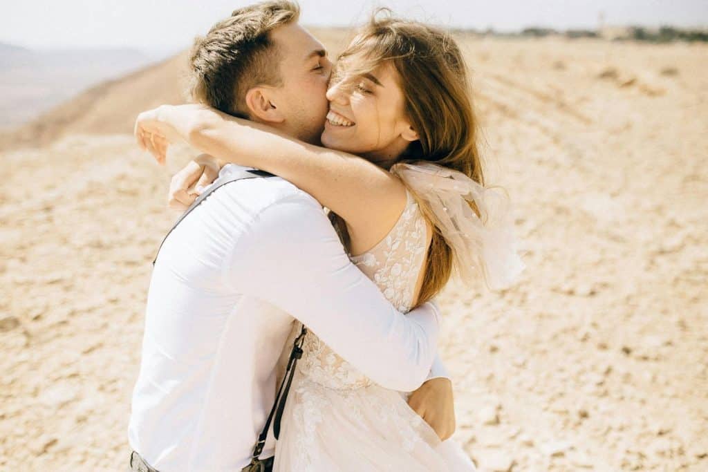 A man and woman hugging