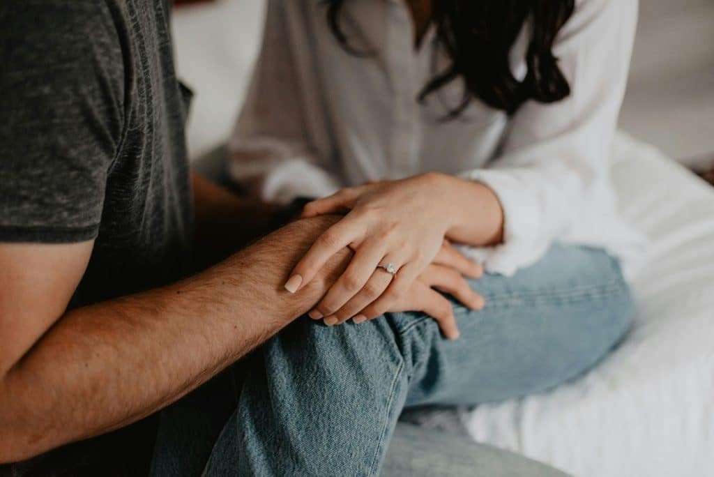 A couple lying on bed