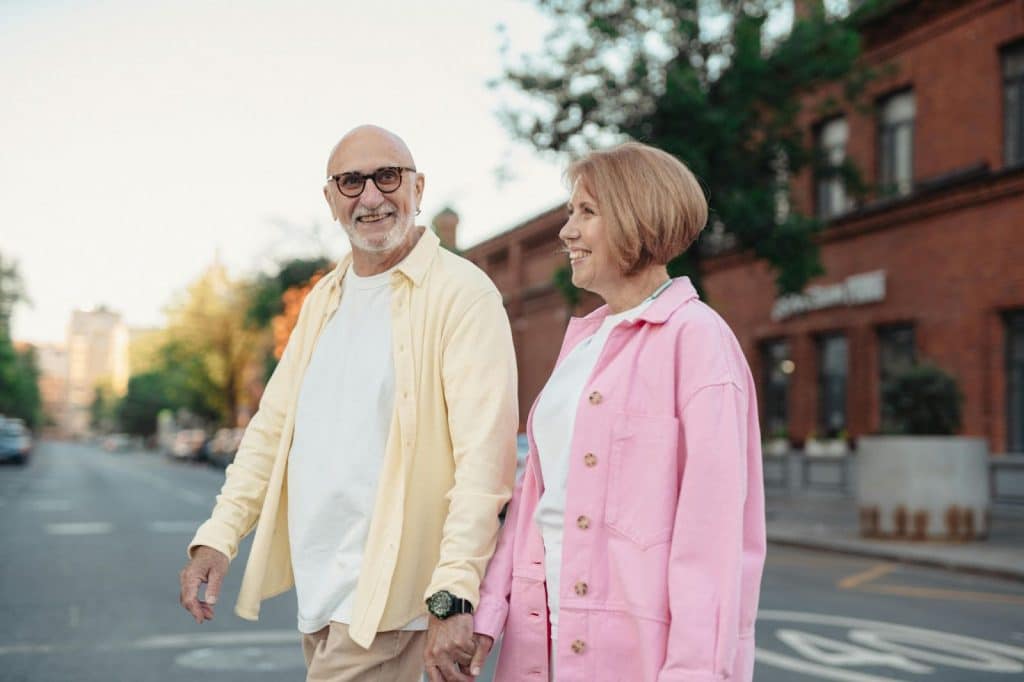 Old couple walking outside