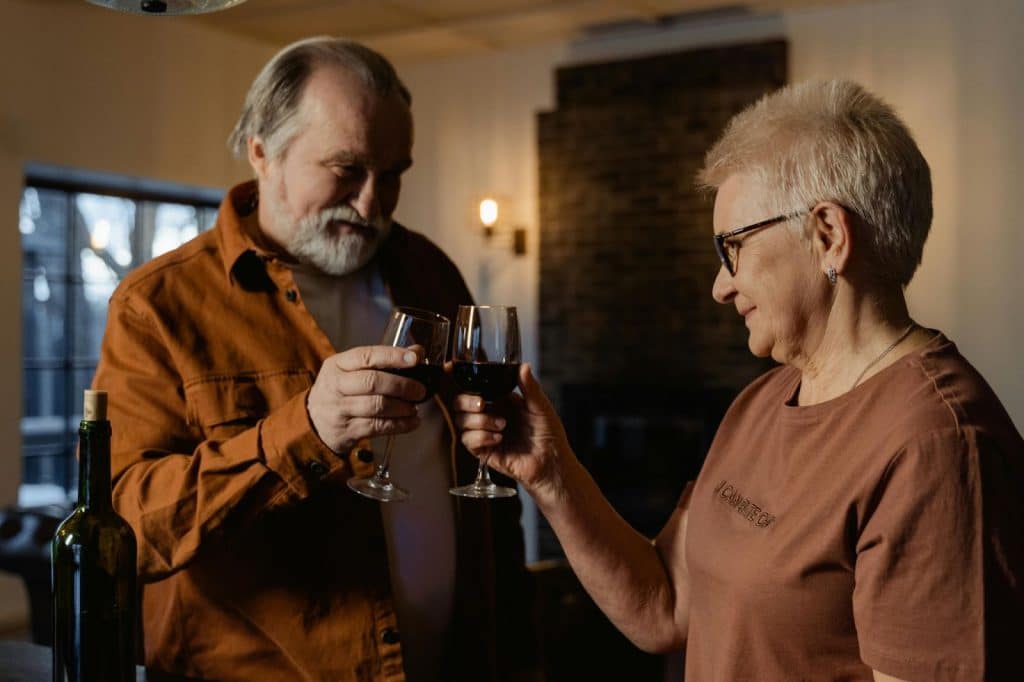 A couple toasting a glass of wine