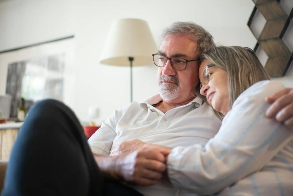 A man hugging a woman