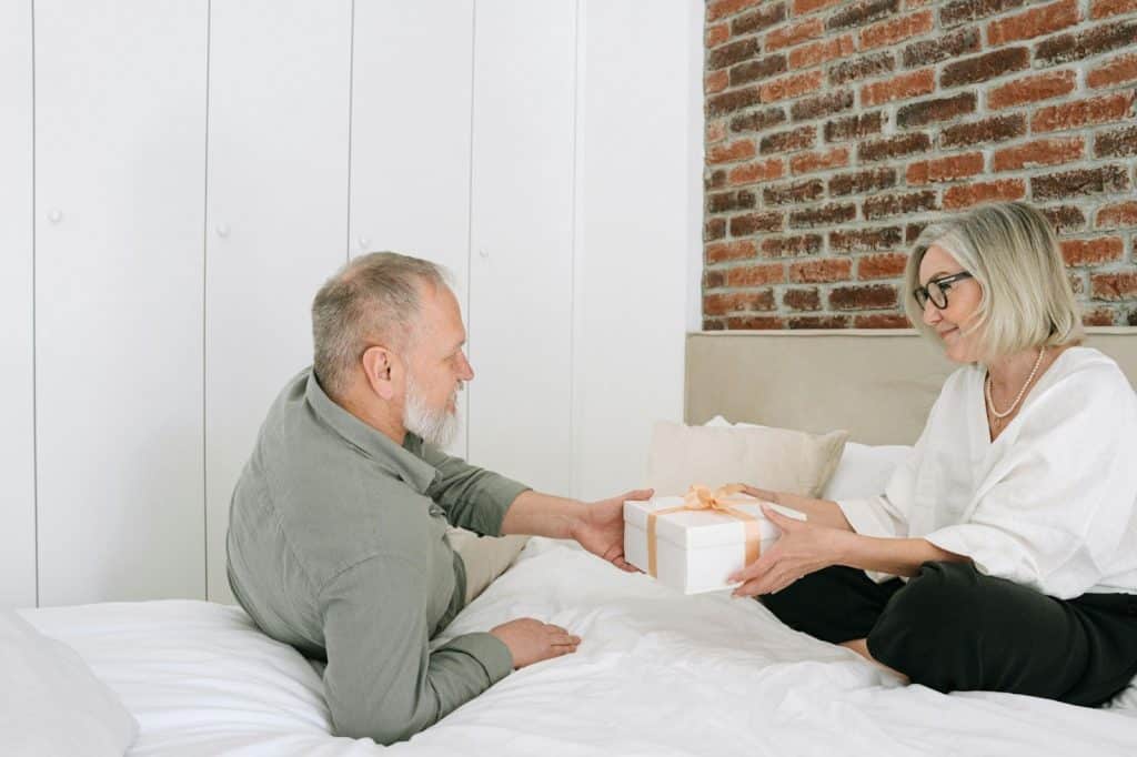 A man giving a woman a gift