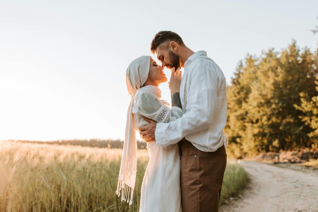 A man and woman facing each other
