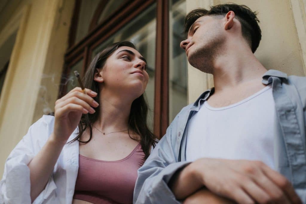 A man and woman looking at each other