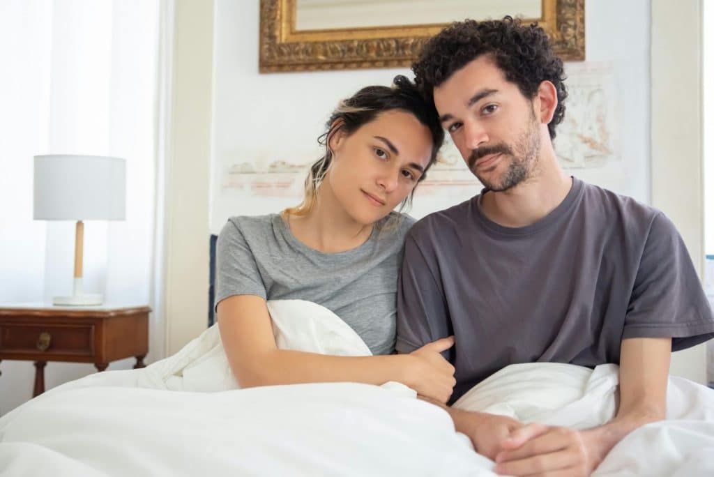 A man and woman smiling
