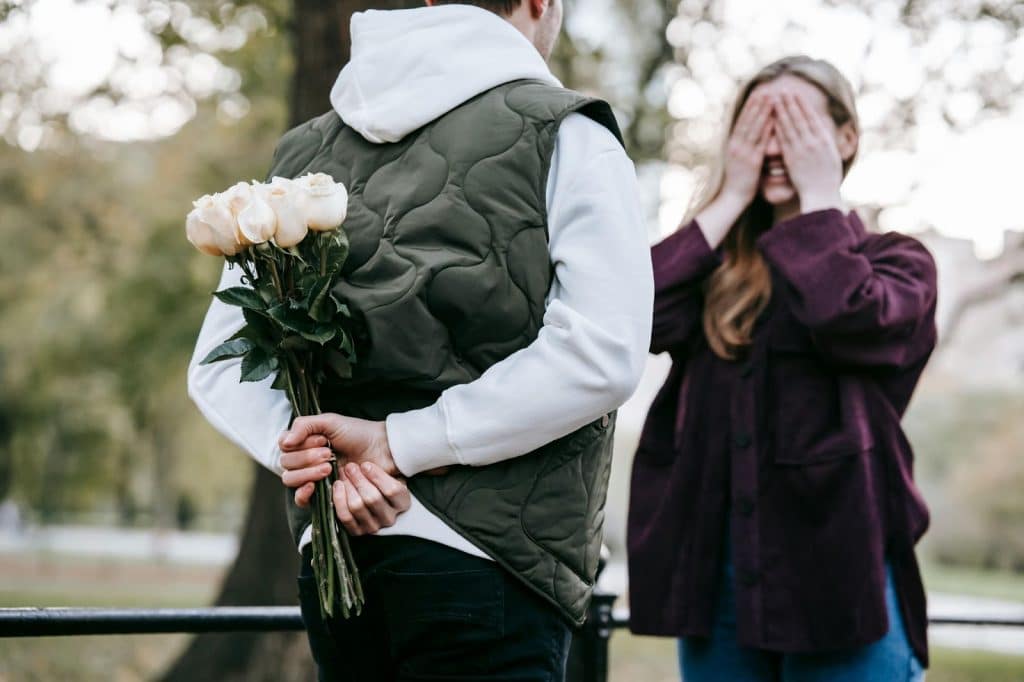 A man will give a flower to woman