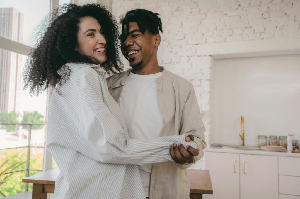 A man and woman laughing together