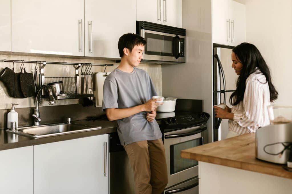 A man and woman at the kitchen