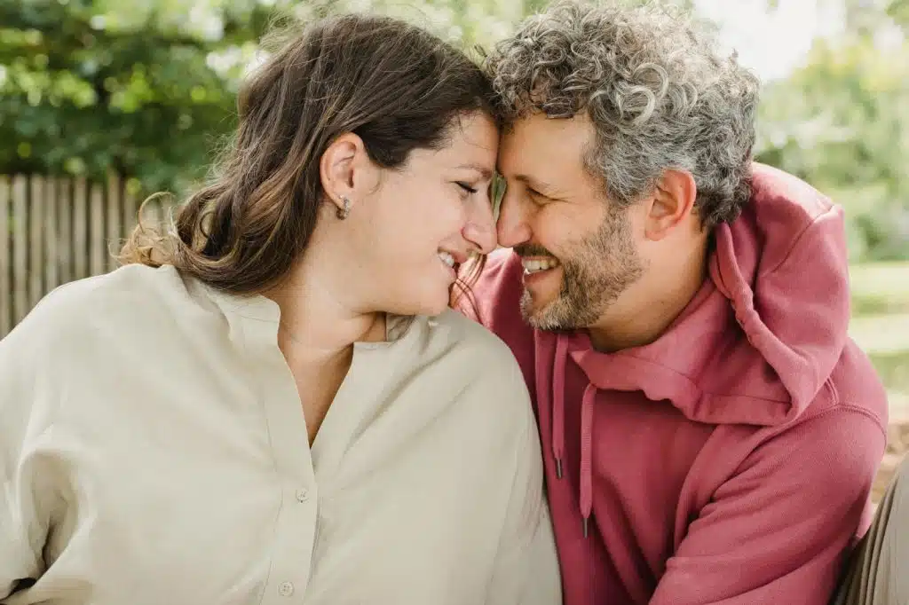 A man and woman facing each other