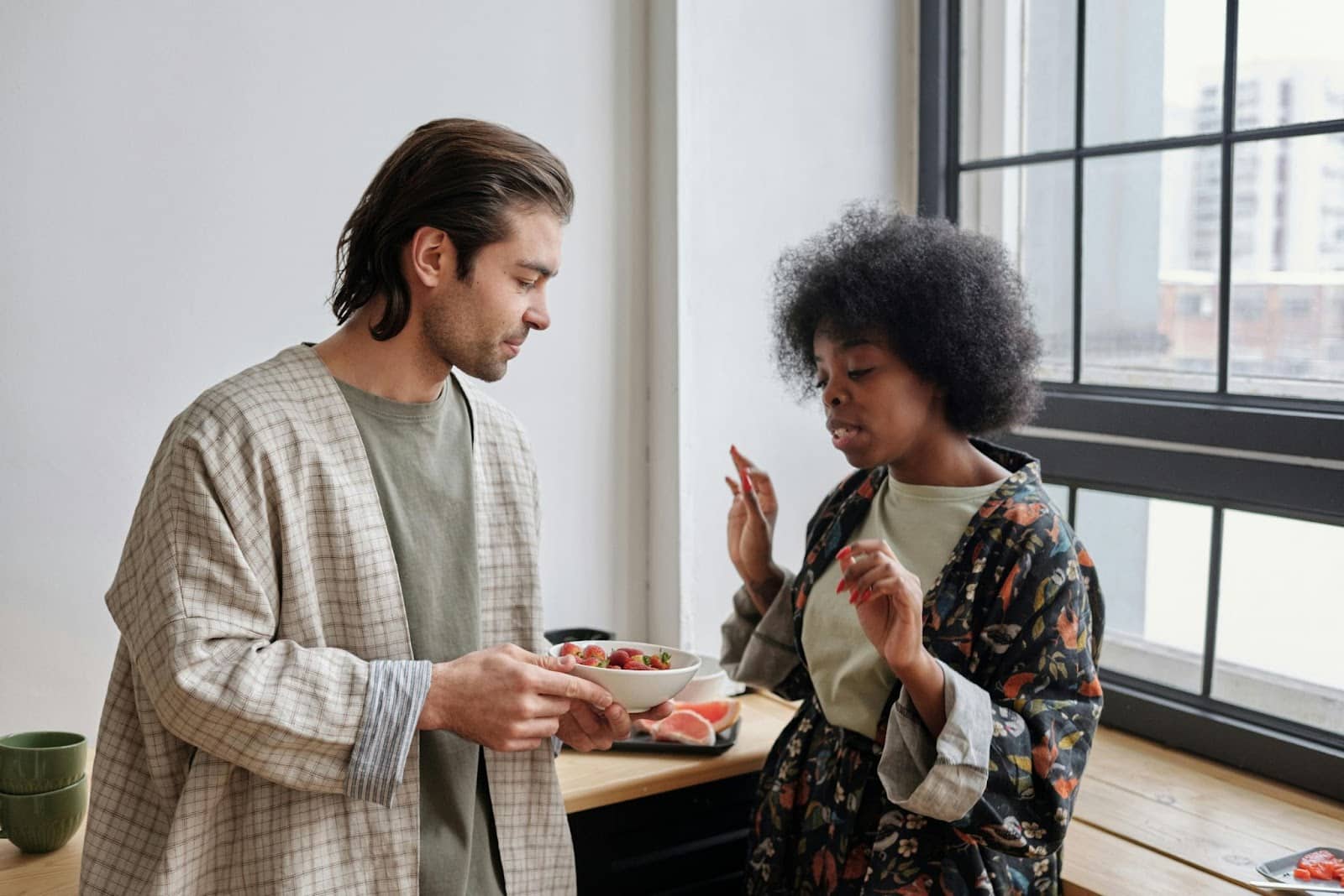 A man listening to a woman