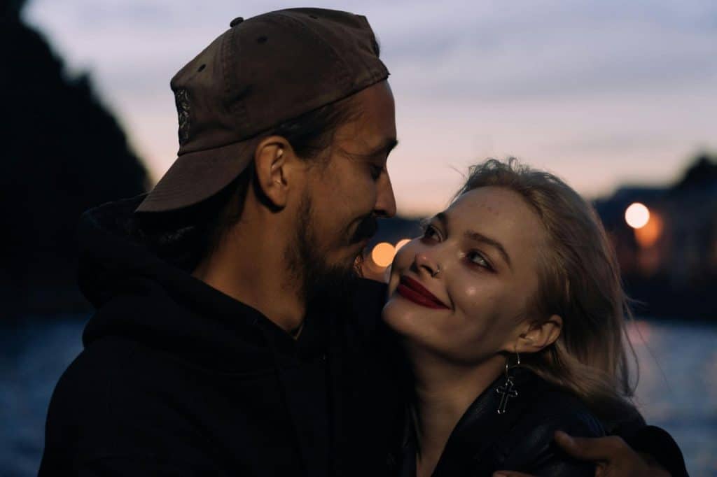 A man and woman facing each other