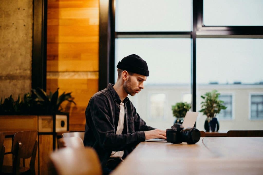 A man alone and using a laptop