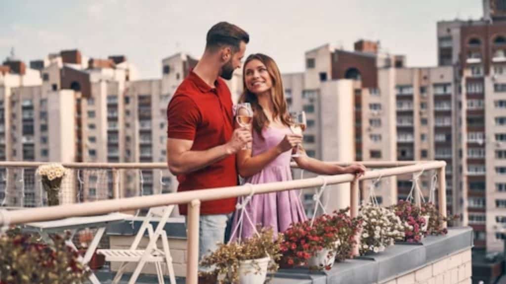 Couple talking closely on a balcony
